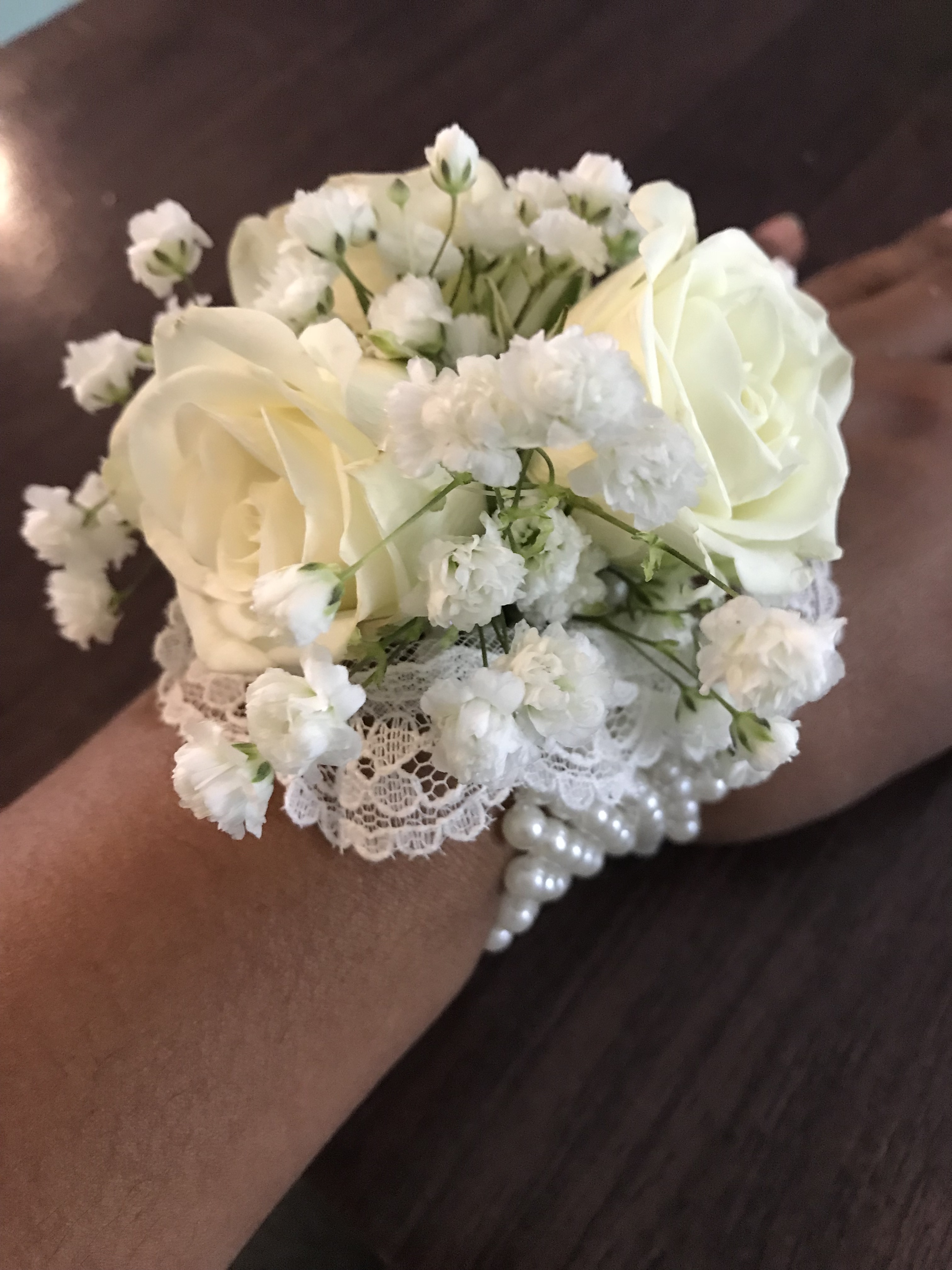 White and ivory corsages and babys breath