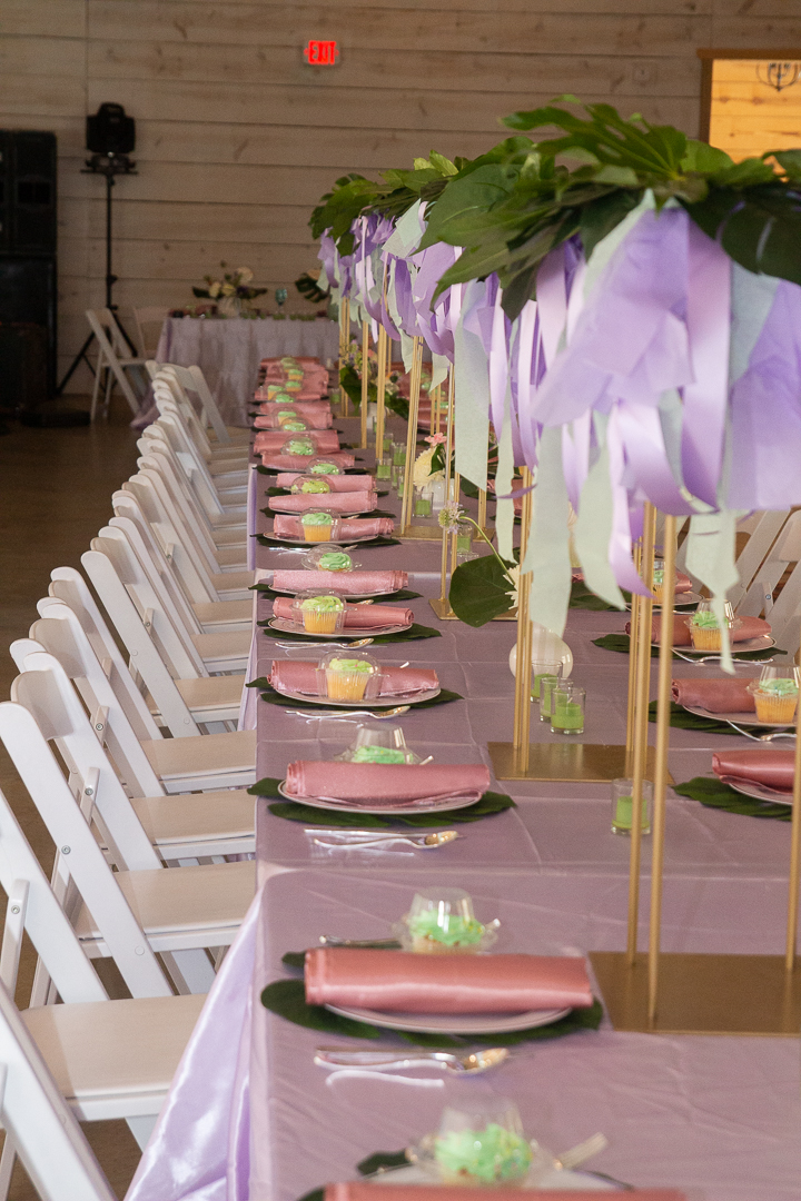 Koury Farms Estate table with lavender and mint ribbon with real monstera leaves